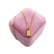 Load image into Gallery viewer, Repurposed YSL Bar & White Enameled Flower Charm Necklace