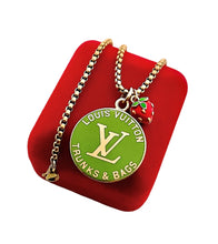 Load image into Gallery viewer, Large Repurposed Louis Vuitton Trunks &amp; Bags Green~Gold Reversible Strawberry Shortcake Necklace