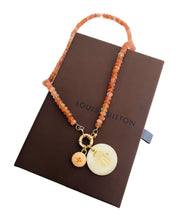 Load image into Gallery viewer, Repurposed Louis Vuitton Peach &amp; Gold Flower Charm &amp; Mother of Pearl Hamsa Sunstone Necklace