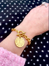 Load image into Gallery viewer, Repurposed Yves Saint Laurent Double Sided Charm Toggle Bracelet